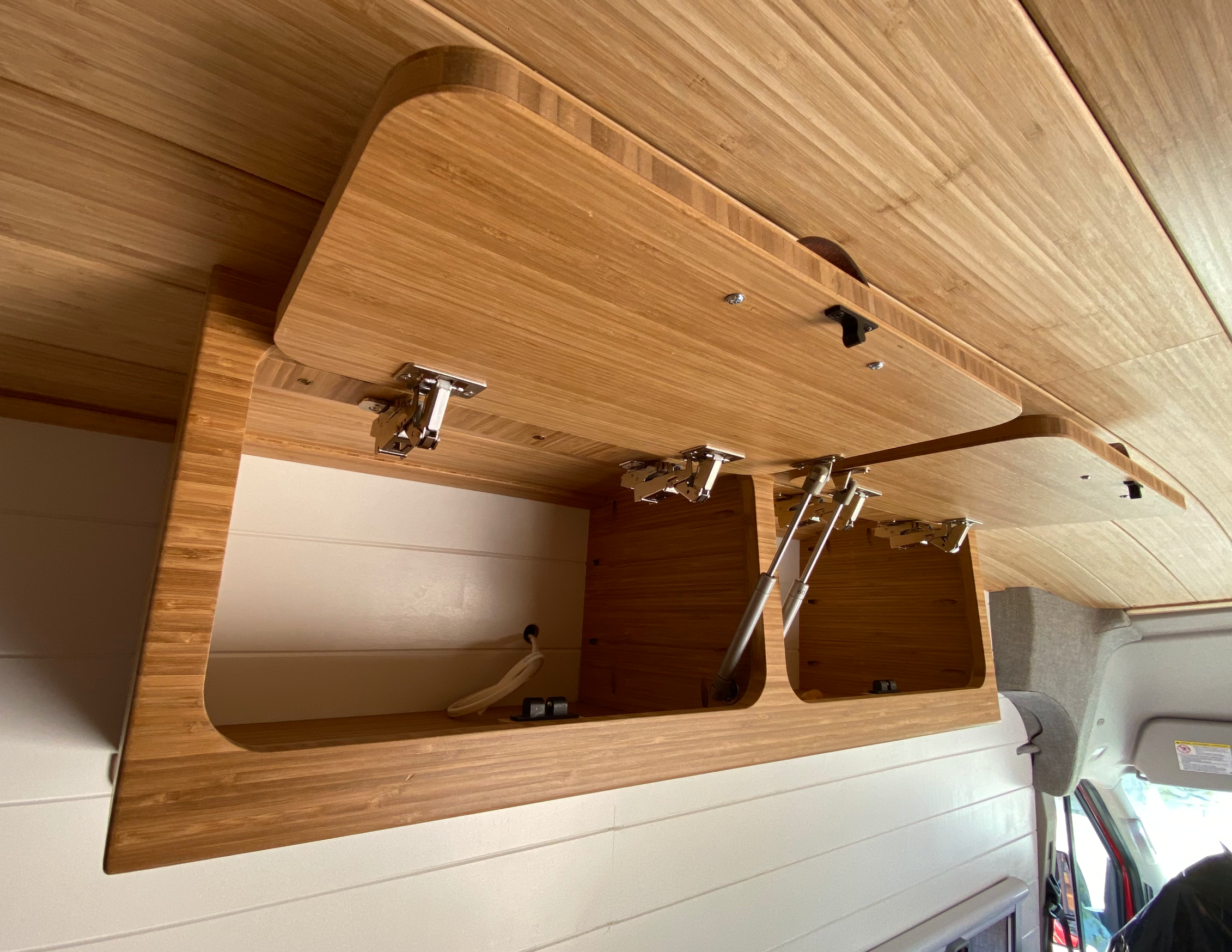 overhead camper van cabinets with door open